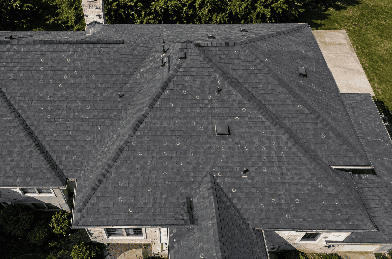 Aerial hail damage survey of a dark roof in Faribault